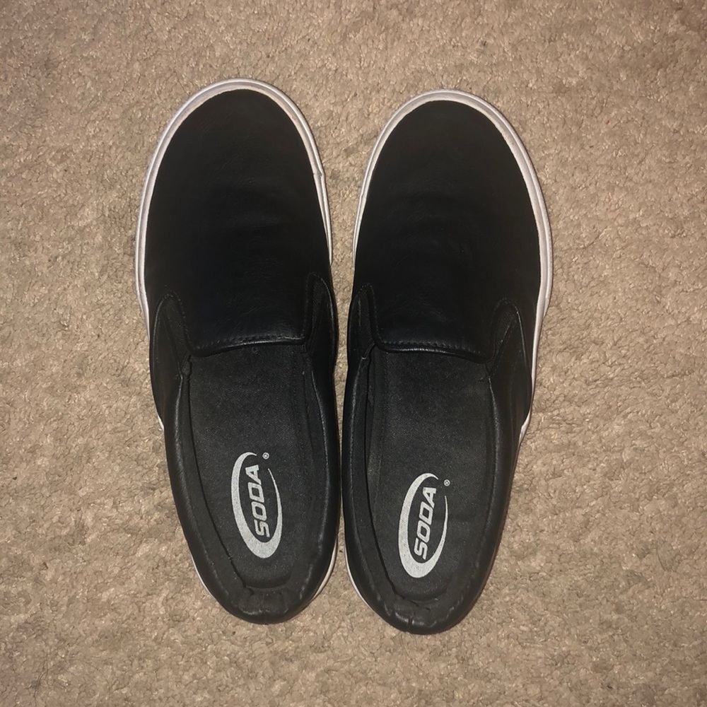 Black slip ons, leather material.